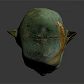 Ancient Greenish Bronze Mask Featuring Golden Accents And Intricate Facial Details