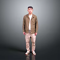 Man in brown shirt white undershirt khaki pants beige shoes against gray black gradient background