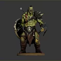 Muscular Green Skinned Man With Shield Spear And Skull Decoration Standing On Base