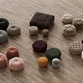 Colorful Fabric Stools With Tufted Design And Various Shapes On Wooden Floor
