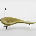 Modern Curved Light Green Sofa With Sleek Lines and Floor Lamp in Minimalist Interior