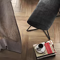 Black Modern Lounge Chair With Ottoman Leather Upholstery Metal Frame Dark Background And Wooden Floor