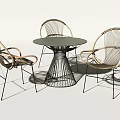 Modern Minimalist Table and Chair Set with Round Dark Tabletop Woven Seats and Metal Frame
