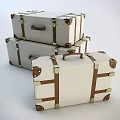 White Suitcases With Brown Straps And Metal Buckles Stacked Together