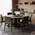 Modern Round Dining Table Set With Upholstered Chairs Potted Plant Plates And Kitchen Cabinets