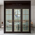 Elegant Dark Framed Sliding Door With Glass Panels And Gold Accents In Dining Room