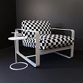 Modern Leisure Chair With Metallic Frame Dark Fabric Upholstery And Round Side Table