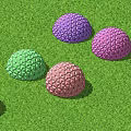 Colorful Hemispherical Decorative Hanging Ornaments With Geometric Patterns On Green Grass