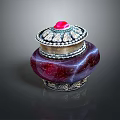 Red Vessel With Silver Decorated Lid And Red Gemstone On Dark Background