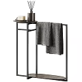 Daily Washing Essentials On Black Metal Stand With Soap Bottle And Gray Towel