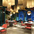 Modern Restaurant Interior With Red Chairs White Tables Pendant Lights And Blue Decorative Walls