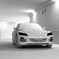 Black Mazda Sports Car Parked In Industrial Style Tunnel With Concrete Walls And Lighting