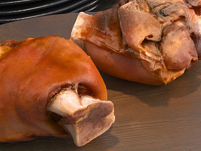 Braised Pork Knuckles With Golden Brown Skin On Wooden Cutting Board 3d model