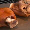 Braised Pork Knuckles With Golden Brown Skin On Wooden Cutting Board