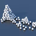 White Decorative Balls Stacked In Small Hill And Scattered On Blue Background