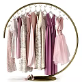 Golden Circular Hanger Holding Various Dresses in Pastel Pink Purple Beige with Lace Tulle Details