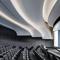 Modern Conference Room Interior With Curved Ceiling LED Lighting Rows of Seats and Lecture Stage
