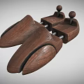 Two Wooden Shoe Stretchers With Natural Wood Construction And Top Knob Design