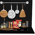 Modern Kitchen Cookware Display Including Hanging Pans Cutting Boards And Spice Jars