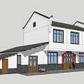 Traditional Chinese Architecture With White Walls Black Tiled Roof And Red Entrance Decorations