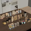 Café Wooden Table Display With Coffee Bags Cans Mugs Pastries And Decorative Prints