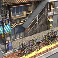 Roadside Facilities With Bicycle Parking Sidewalk Stairs Blue White Striped Awning Stalls And Poles