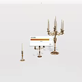 Set of Three Ornate Metal Candleholders With Various Heights And Decorative Details