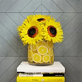 Yellow Sunflowers in Transparent Vase with Lemon Slices against Gray Diamond Wall