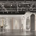 Modern Clothing Store Interior Design With Clothing Racks Mannequins And Green Plants