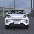 White Compact Electric Car With Modern Design And LED Headlights In Outdoor Building Setting