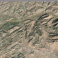 Aerial View Of Mountainous Terrain With Winding River And Rugged Ranges