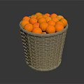 Grey Woven Basket Filled With Round Orange Decorative Balls On Dark Surface