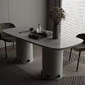 Modern Bar Counter With Marble Top Cylindrical Bases Gray Chairs Dried Flower Vase And Books