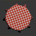 Round Dining Table With Red And White Checkered Tablecloth And Wooden Legs