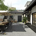 Elegant New Chinese Courtyard Landscape With Cozy Outdoor Dining Spaces And Lush Green Plants