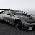 BMW Silver Gray Sports Car With Yellow Accents And Large Rear Wing On Coastal Road