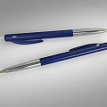 Two Blue Ballpoint Pens With Silver Accents Laid On Gray Surface