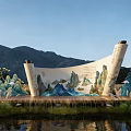 Scroll Shaped Landscape Sculpture With Traditional Chinese Landscape Painting And Mountain Backdrop