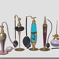 Vintage Decorative Perfume Bottles With Ornate Gold Accents And Colorful Designs