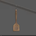 Wooden Kitchen Spatula Hanging On Metal Rod Against Blue Background