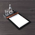 Workspace Essentials Display With Clipboard Blank Paper Glass Water Bottle Pencil On Dark Wooden Table