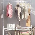 White Clothes Rack With Various Garments In Bedroom And Shoes On Shelf