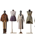 Fashion Mannequins Displaying Stylish Coats Skirts Dresses And Trench Coats In Various Colors