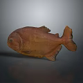 Brown Fish Model With Detailed Fins And Tail On Gray Reflective Surface Displaying Natural Texture