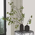 Gray Vases Holding Green Leaf Branches Placed on Table with Curtain and Natural Light