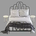 Modern Black Metal Double Bed With Gold Accents White Pillows And White Nightstands