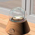 Illuminated Decorative Lamp With Transparent Glass Dome And Wooden Base On Window Sill