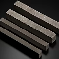 Four Gray Rectangular Concrete Columns With Textured Surface In A Row