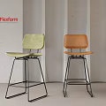 Flexform Modern Bar Stools With Green And Orange Seats Metal Frame Gray Wall Background
