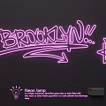 Stylish Neon Light Combination With Pink Glowing BROOKLYN Sign And Star Shape On Dark Background